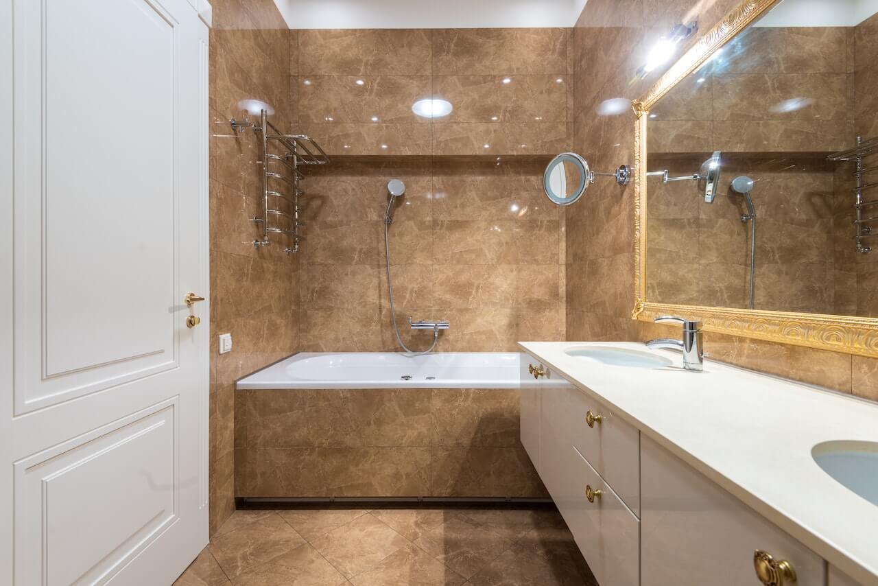washroom with sink and bath tub