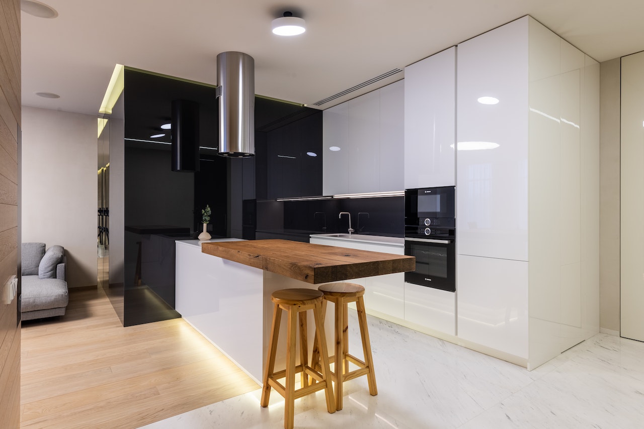 open kitchen walls are black marbel, oven and sink